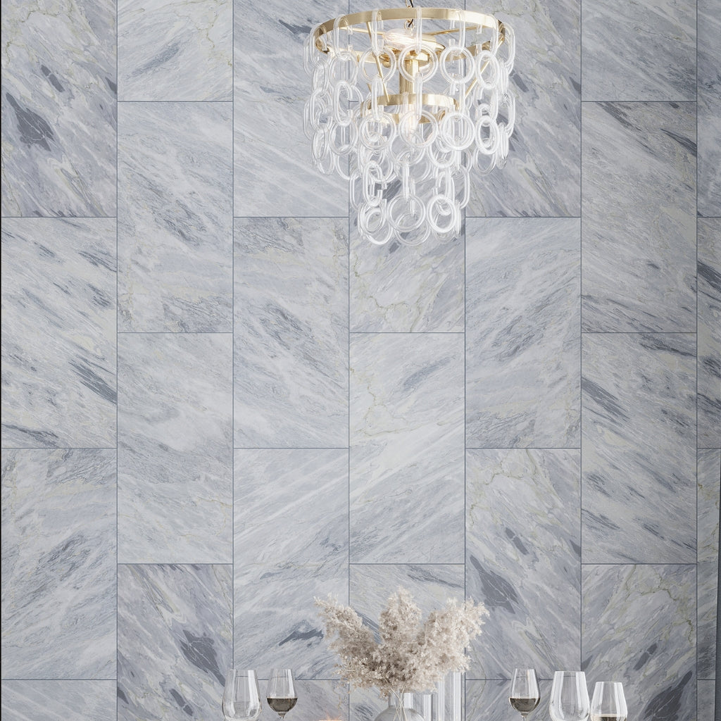gray 12x24 polished calacatta bluette marble large format tile with subtle veining and reflective finish