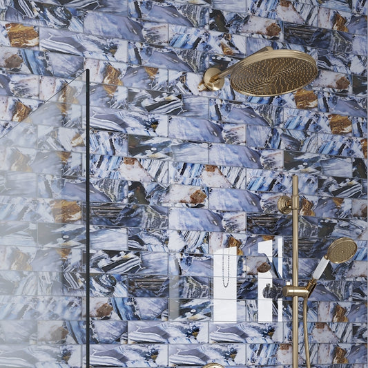 glossy brown blue 3x12 glass subway tile with abstract mineral patterns in shower setting