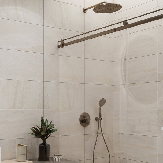 beige 12x24 matte porcelain tile installed on shower walls with large format sleek design