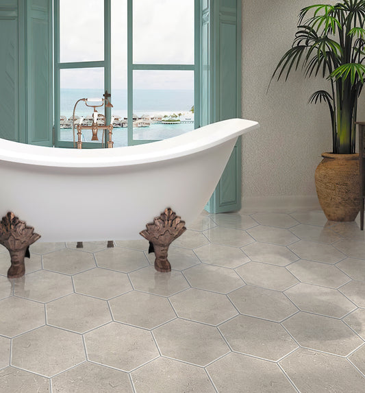 Beige polished Crema Marfil marble hexagon floor tiles with honed finish in bathroom setting