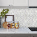 White recycled glass hexagon mosaic tile with matte and glossy finishes on the kitchen backsplash