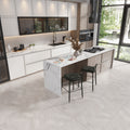 Gray matte porcelain large format chevron floor tiles in kitchen setting