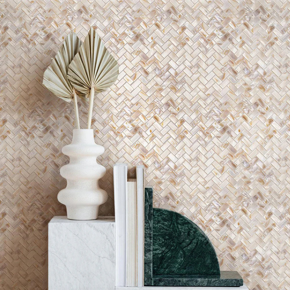 White and beige mother of pearl mosaic tile in a polished herringbone pattern