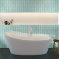 Blizzard blue glossy 4x16 glass subway tile on bathroom wall