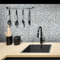Blue glossy glass herringbone mosaic tile backsplash in 12x12 size on kitchen wall