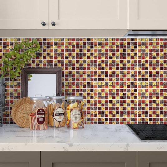 Glossy foiled glass mosaic tile in gold and red, 12x12 inches, used as kitchen backsplash.