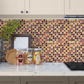 Glossy foiled glass mosaic tile in gold and red, 12x12 inches, used as kitchen backsplash.