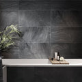 Coal black 12x24 matte porcelain tiles on bathroom wall