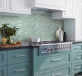 Tiffany blue multi-shaped glass mosaic tile with polished and honed finish on kitchen backsplash