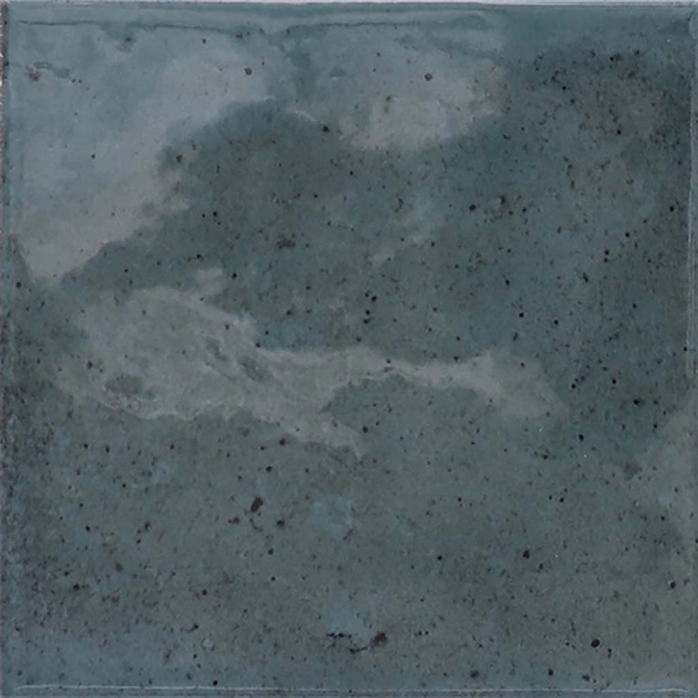 Raised fireplace hearth ideas in spruce blue glossy square ceramic tile