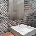 Silver glossy square glass mosaic tile 12x12 inches installed on bathroom wall