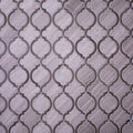 Polished natural stone tile with grey arabesque honeycomb wood-look pattern and mosaic design