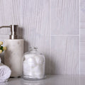 White matte porcelain brick look tile 4x13 inches installed on bathroom wall